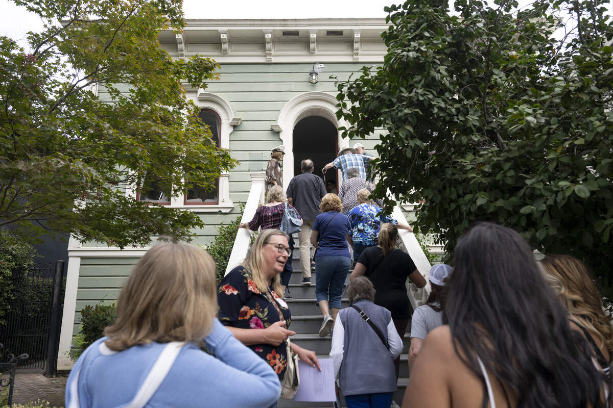 Visitors walk up the steps to the James H. Winn House during Preservation Sacramento’s annual historic home tour in Sacramento on Sunday. The home is the oldest building on this year’s tour.